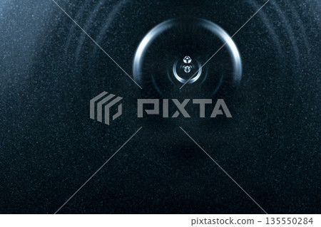 Drops of water falling on the water surface and beautiful ripples Drops of water falling on the water surface and beautiful ripples 135550284