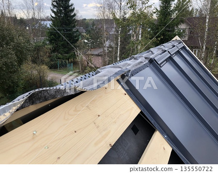 Construction of a rural house roof top view Construction of a rural house roof top view 135550722