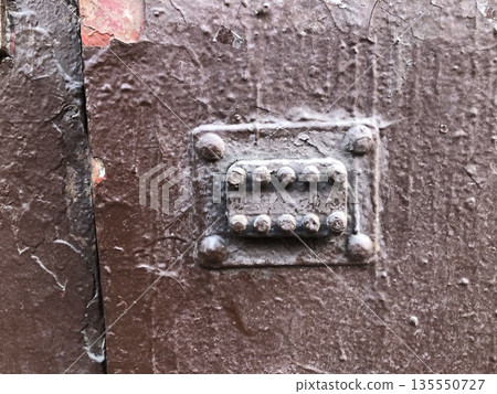 combination lock on an old door 135550727