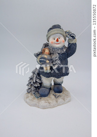 Dressed snowman isolated on white background Dressed snowman isolated on white background 135550872