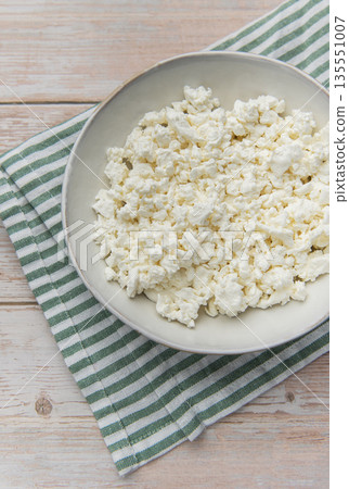 Fresh natural cottage cheese on wooden background with napkin Fresh natural cottage cheese on wooden background with napkin 135551007