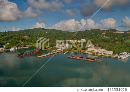 Mahogany Bay in Roatan, Honduras, is a cruise port by Carnival, offering shops, restaurants, and access to the scenic Mahogany Beach via a short walk or a paid "Magical Flying Beach Chair" lift Mahogany Bay in Roatan, Honduras, is a cruise port by Carnival, offering shops, restaurants, and access to the scenic Mahogany Beach via a short walk or a paid "Magical Flying Beach Chair" lift 135551056