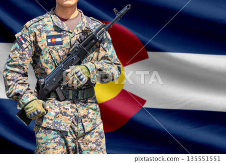 Colorado US state flag with soldier holding assault rifle Colorado US state flag with soldier holding assault rifle 135551551