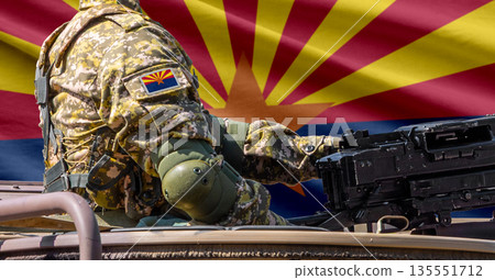 Arizona US state flag with soldier at machinegun turret 135551712