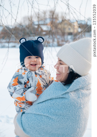 Mother and Baby Enjoying a Winter Day 135552039