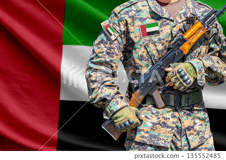 United Arab Emirates flag with soldier holding assault rifle United Arab Emirates flag with soldier holding assault rifle 135552485