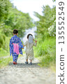 Back view of a brother and sister walking in yukata 135552549