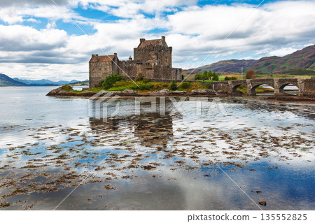 Eilean Donan Castle and stone bridge at low tide Scotland Eilean Donan Castle and stone bridge at low tide Scotland 135552825