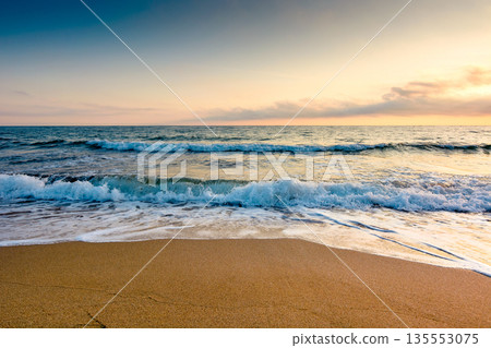 sand beach at the sea for summer vacation concept. beautiful sunrise at perfect bulgaria coast with calm waves and clouds on sky. beautiful morning landscape for holiday and travel background 135553075