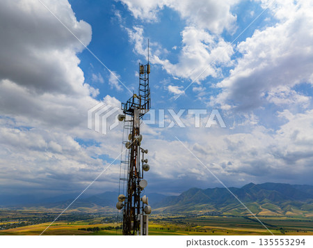 Communications tower and antennas in rural landscape Communications tower and antennas in rural landscape 135553294