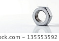Metallic Nut on White Background with Smooth Reflective Surface 135553592