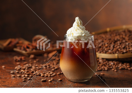 Iced coffee with whipped cream. 135553825