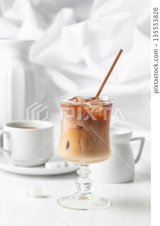 Iced coffee with cream and cup of black coffee. 135553826