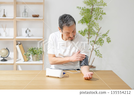 Men measuring blood pressure 135554212