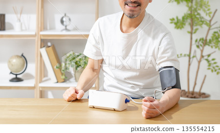 Men measuring blood pressure 135554215