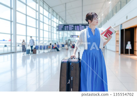 A woman going on a trip 135554702