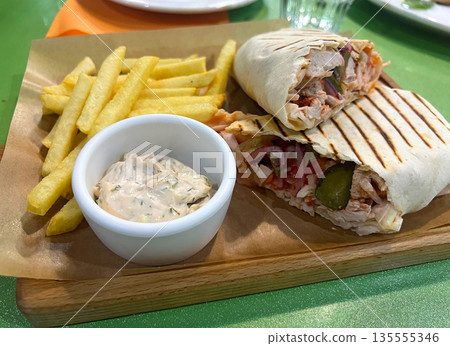 Shawarma with tartar sauce and French fries Shawarma with tartar sauce and French fries 135555346