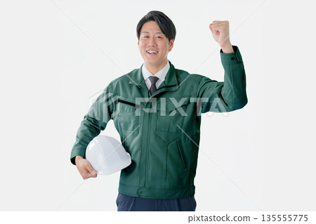 A refreshing worker pumping his fist A refreshing worker pumping his fist 135555775
