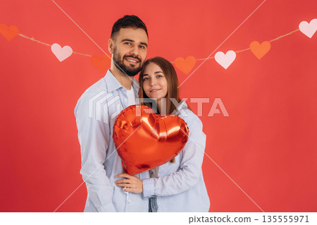 Celebrating Valentine's day. Lovely couple are together in the studio Celebrating Valentine's day. Lovely couple are together in the studio 135555971