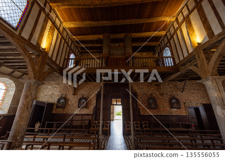 Rustic timber chapel interior with exposed beams and balconyParfondeval, Vervins, Aisne, Hauts-de Rustic timber chapel interior with exposed beams and balconyParfondeval, Vervins, Aisne, Hauts-de 135556055