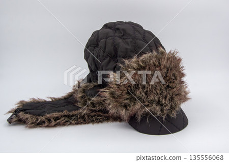 Warm winter cap with fur and long ear warmers Warm winter cap with fur and long ear warmers 135556068