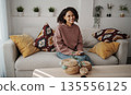 Serene Lady Enjoying Peaceful Pause, Peaceful Woman Seated On Couch Embracing Calm Reflection Moment 135556125