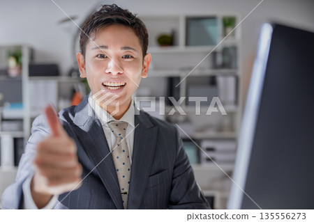 Businessman with thumbs up 135556273