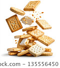 Biscuits falling on a pile of biscuits isolated on white background. 135556450