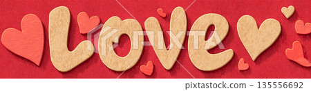 Textured love word with hearts on red background. Textured word love with small hearts creating a festive Valentine's Day or romantic design 135556692