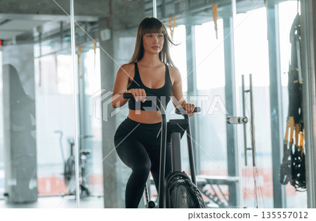 Vitality, warm up, cardio. Young woman is in the gym 135557012