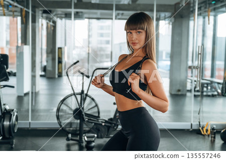 Young woman is in the gym 135557246