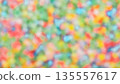 Abstract blurred background of colorful foam beads with bokeh effect. 135557617