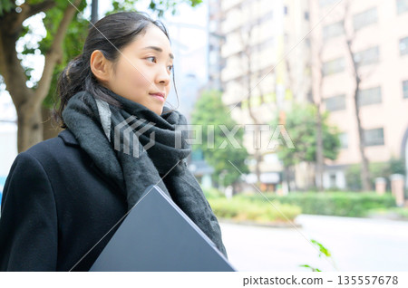 Japanese woman with laptop in the city 135557678