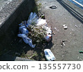 Garbage and weeds left on the side of the road 135557730