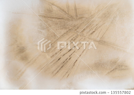 Frozen ice texture with brown abstract patterns Frozen ice texture with brown abstract patterns 135557802