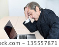 Senior man in a suit worried in front of a laptop 135557871