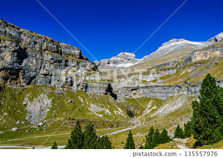 Walking on the Hunter's Trail, Senda de los Cazadores in autumn. Ordesa and Monte Perdido Natural Park, Pyrenees, Spain Walking on the Hunter's Trail, Senda de los Cazadores in autumn. Ordesa and Monte Perdido Natural Park, Pyrenees, Spain 135557976