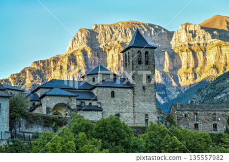 Church of Torla, door to the Ordesa National Park in the Pyrennes close to the border between Spain and France. Church of Torla, door to the Ordesa National Park in the Pyrennes close to the border between Spain and France. 135557982