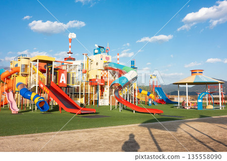 Parks with large playground equipment, giant park slides, and giant jungle gyms Parks with large playground equipment, giant park slides, and giant jungle gyms 135558090