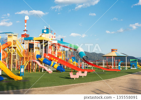 Parks with large playground equipment, giant park slides, and giant jungle gyms Parks with large playground equipment, giant park slides, and giant jungle gyms 135558091