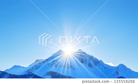 Sunrise over snow-capped mountain peak under clear blue sky Sunrise over snow-capped mountain peak under clear blue sky 135558208