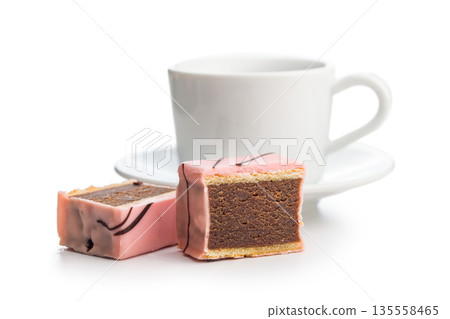 Sweet dessert cake. Mini pie and coffee cup isolated on white background. Sweet dessert cake. Mini pie and coffee cup isolated on white background. 135558465