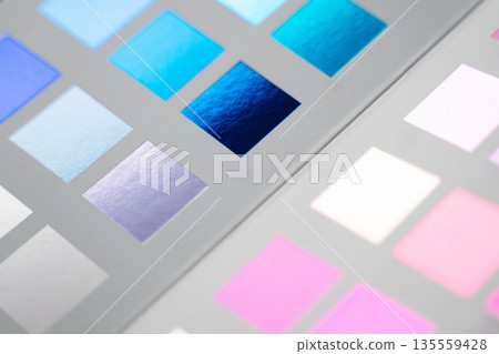 Closeup of color print metallic swatches sampler with various shades of blue and pink 135559428