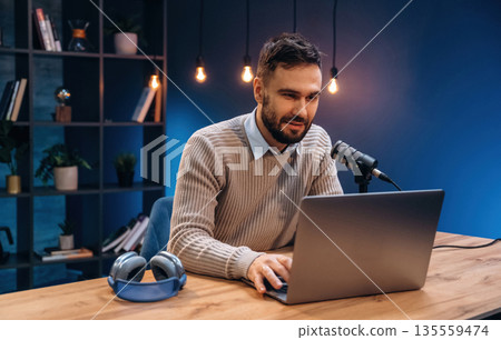 Man is on the radio doing podcast live 135559474
