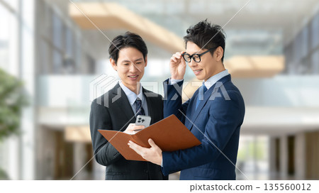 Two male businessmen having a meeting Two male businessmen having a meeting 135560012