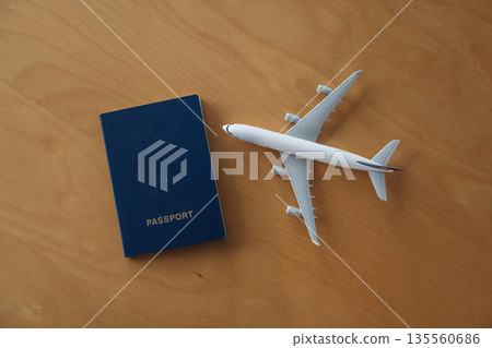 Clean surface. Detailed close up view of toy plane and passport 135560686