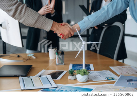Deal, making handshake. Business people are working in the office 135560902