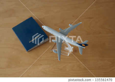 Top close up view of toy plane and passport 135561470