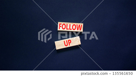 Follow up symbol. Concept word Follow up on beautiful wooden blocks. Beautiful black paper background. Business follow up concept. Copy space. Follow up symbol. Concept word Follow up on beautiful wooden blocks. Beautiful black paper background. Business follow up concept. Copy space. 135561650