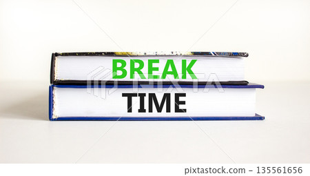 Break time symbol. Concept word Break time on beautiful books. Beautiful white paper background. Business break time concept. Copy space. Break time symbol. Concept word Break time on beautiful books. Beautiful white paper background. Business break time concept. Copy space. 135561656